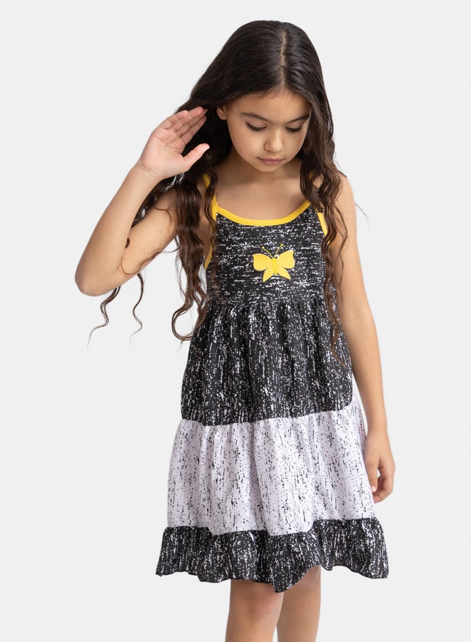 فستان أبيض وأسود للبنات بتطريز زهور