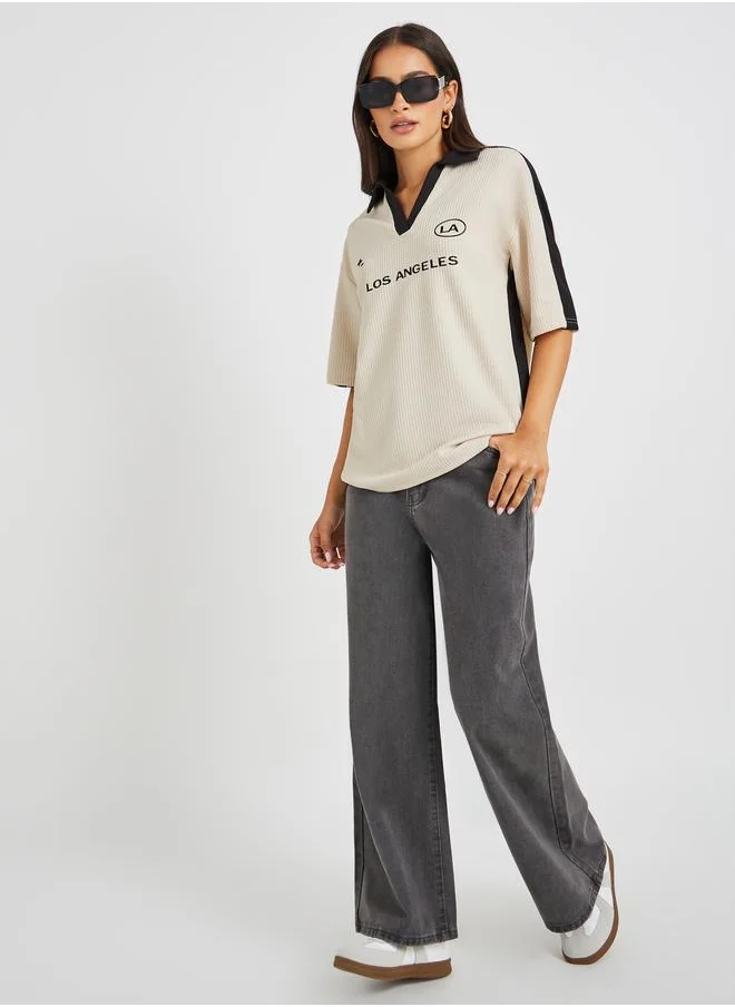 ستايلي Styli Slogan Print Short Sleeve Collared Oversized T-Shirt