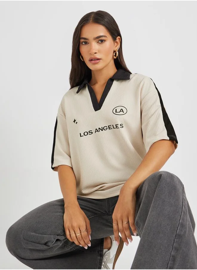 ستايلي Styli Slogan Print Short Sleeve Collared Oversized T-Shirt