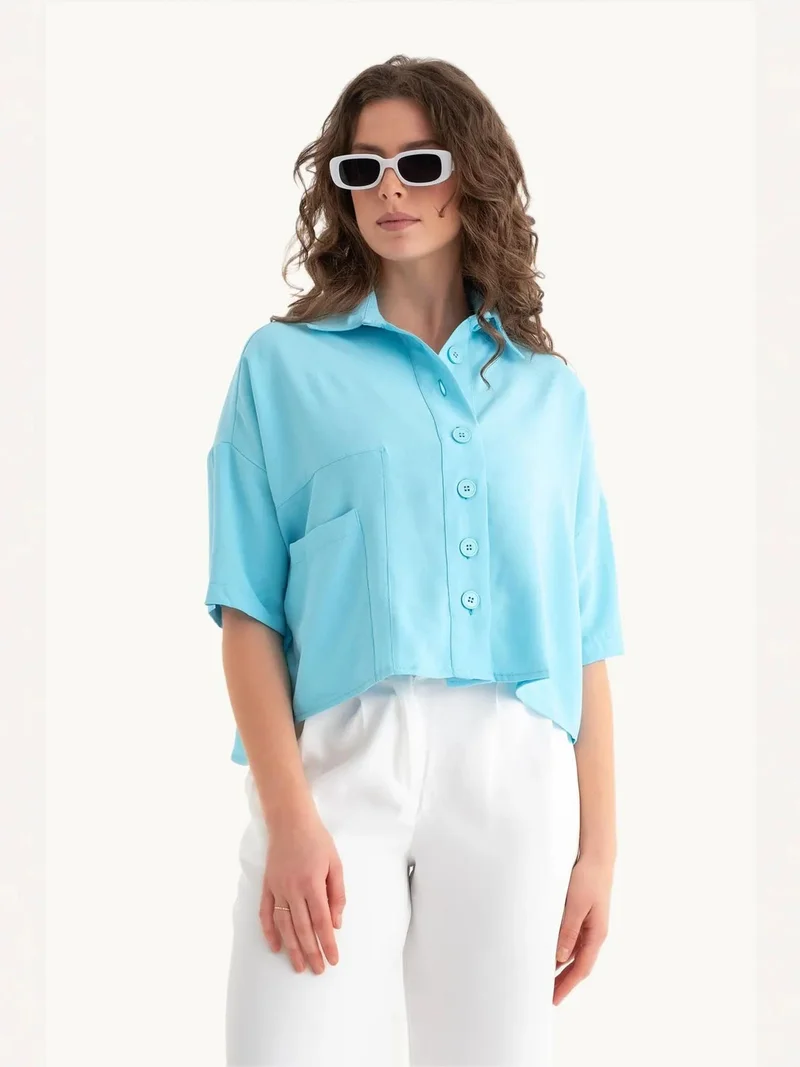زوبعة قميص بجيب مع تفاصيل زر