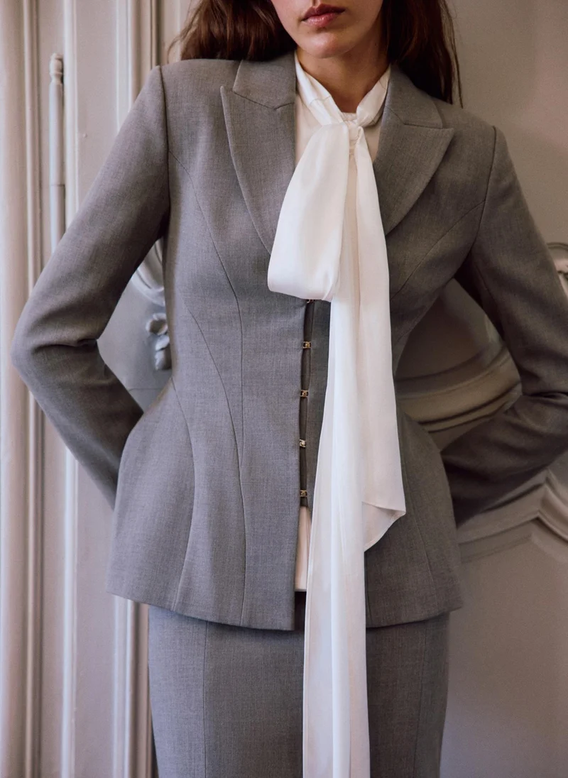 Lichi Fitted jacket with voluminous inserts at the hips