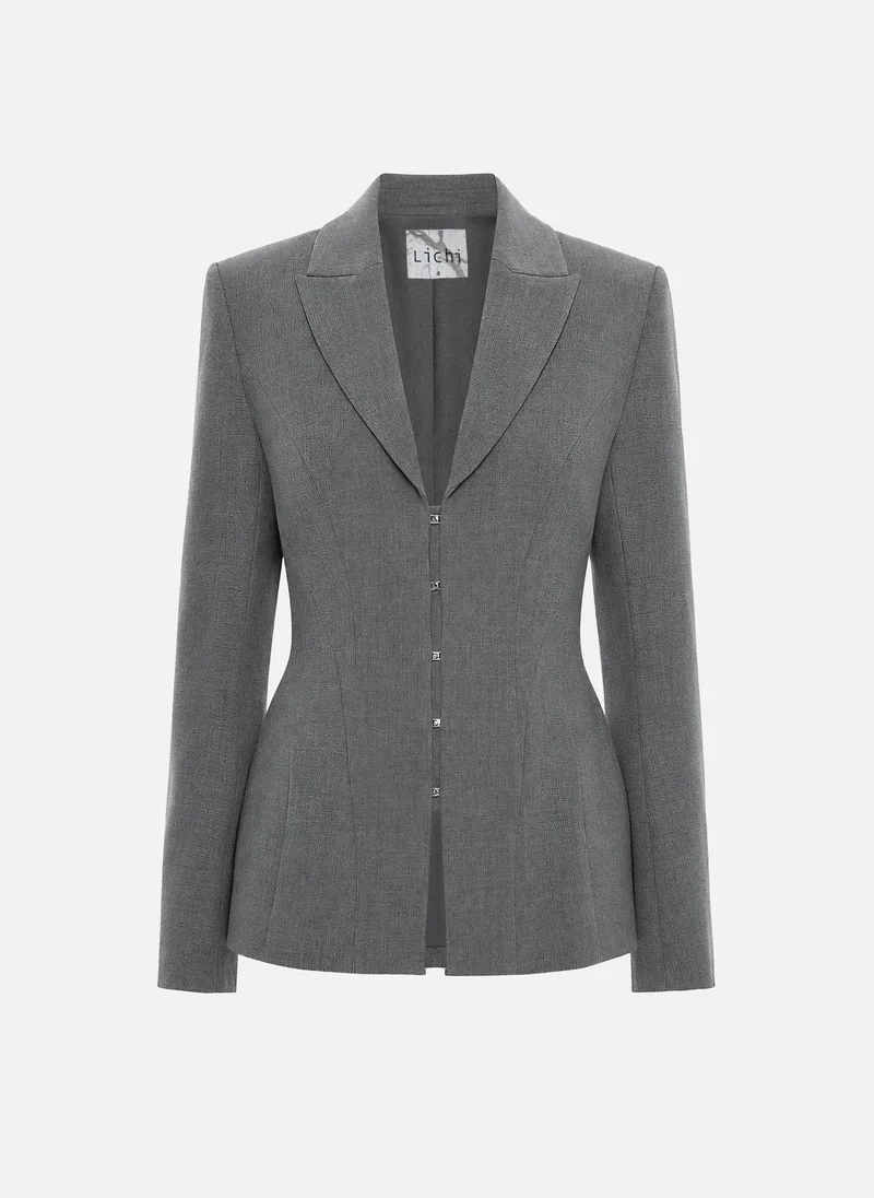 Lichi Fitted jacket with voluminous inserts at the hips