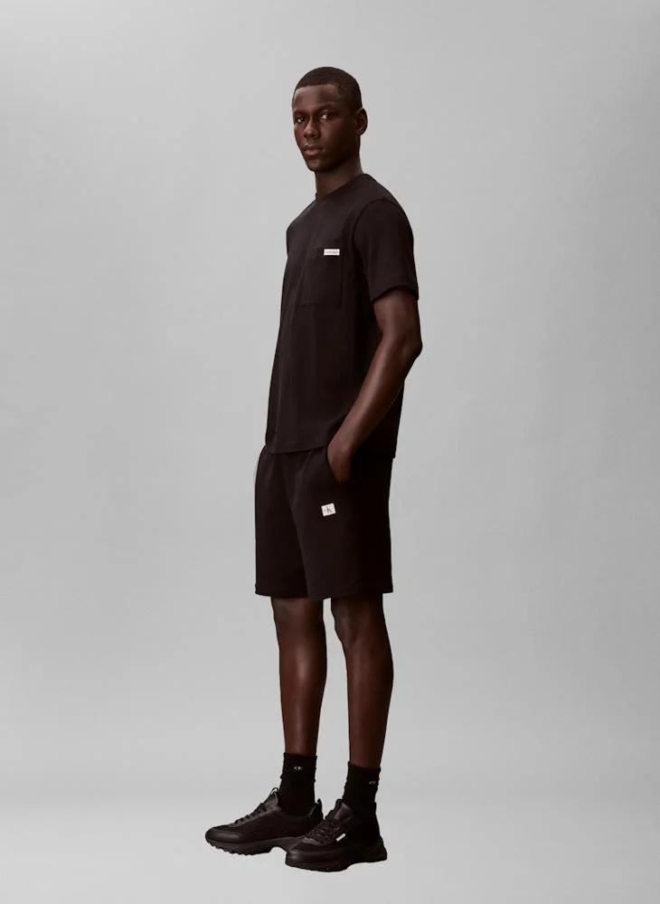 Calvin Klein Jeans  Cotton Terry Badge Jogger Shorts for Men | Best Price UAE