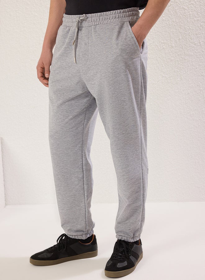 trendyol Gray Melange Oversize/Wide Cut Elastic Leg Butterfly Printed Sweatpants - Image 4