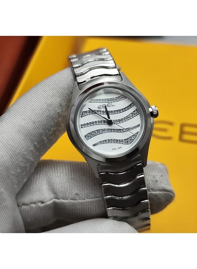 The Ebel women's watch features a classic design with a distinctive wave-shaped strap.