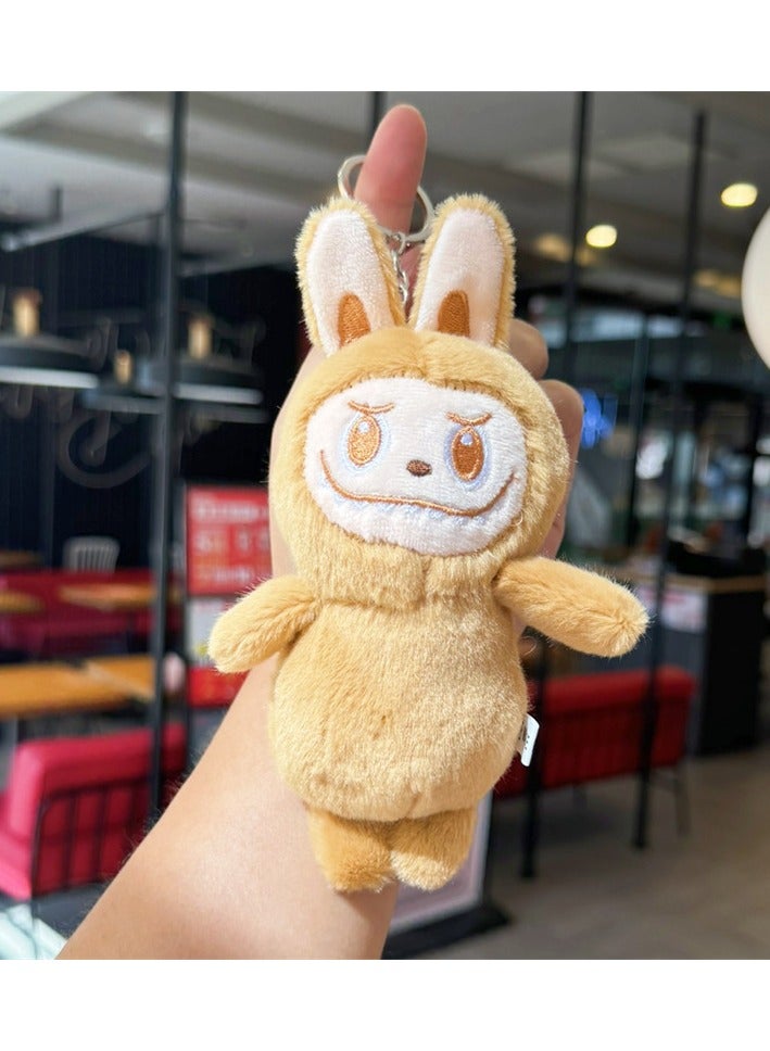 The new Labubu plush toy key chain is a charming gift. The frown cloth is rose yellow and 15 centimeters long 