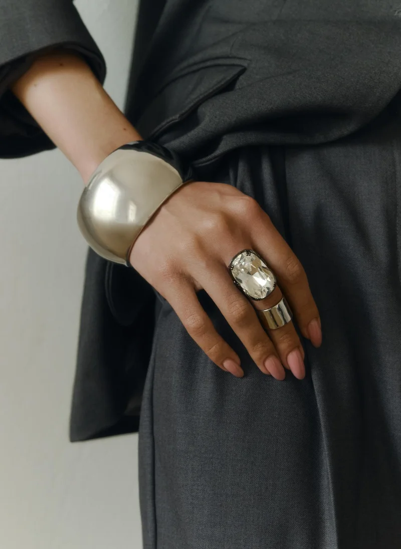 Ring with a large faceted stone