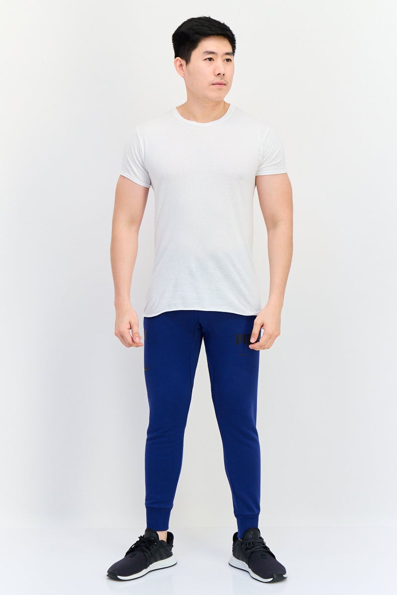 PUMA سروال رياضي خارجي للرجال بقصة عادية بشعار العلامة التجارية، أزرق - Image 2