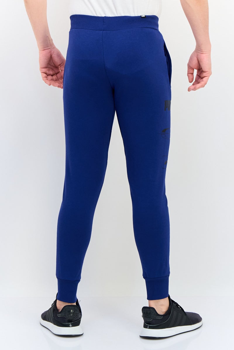 PUMA سروال رياضي خارجي للرجال بقصة عادية بشعار العلامة التجارية، أزرق - Image 4