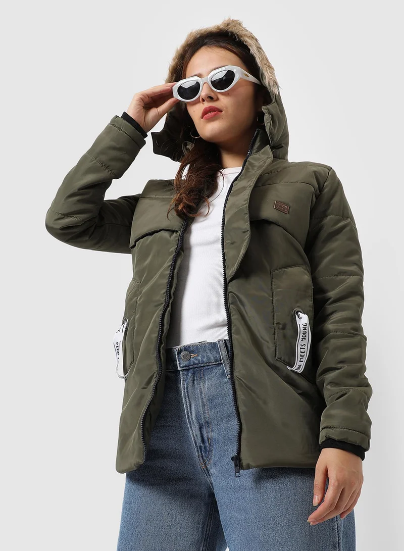 Campus Sutra Women's Olive Green Long Puffer Jacket With Fur Detail For Casual Wear | Hooded Neck  | Long Sleeve | Zipper Closure | Polyester Jacket Crafted With Comfort Fit For Everyday Wear