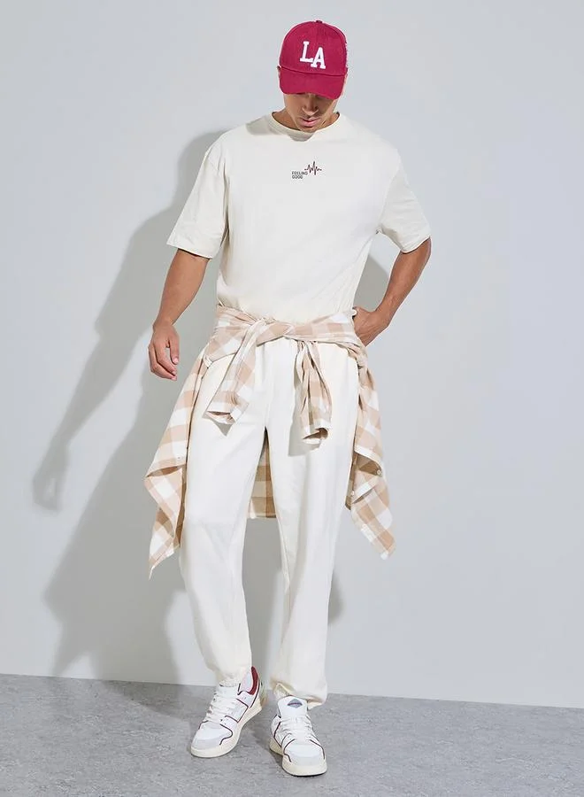 ستايلي Cream Solid Elasticated Hem Relaxed Fit Joggers