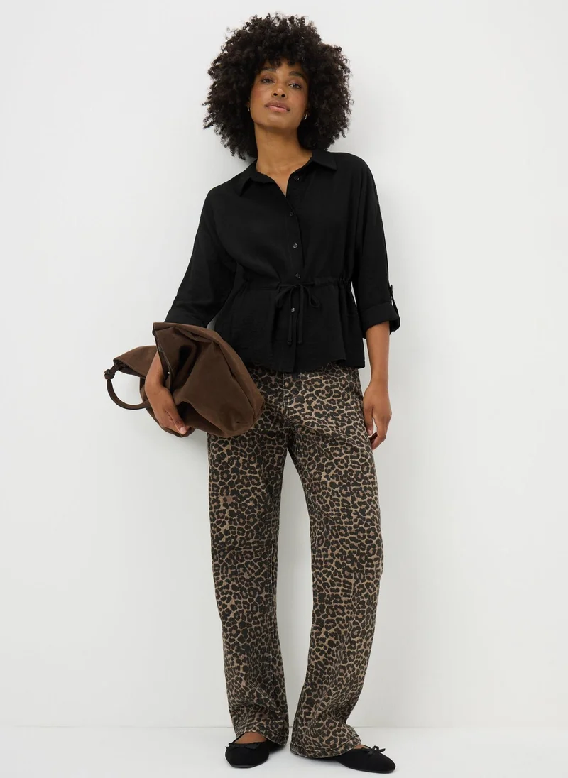 ماتلان قميص أسود بأكمام طويلة بخصر بقناة