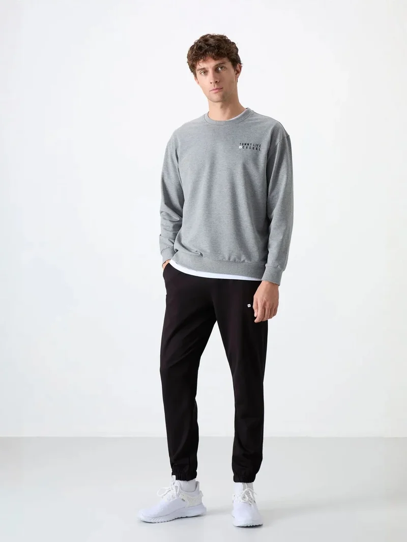 تومي لايف TOMMY Men's Oversized Sweatshirt And Pants Set