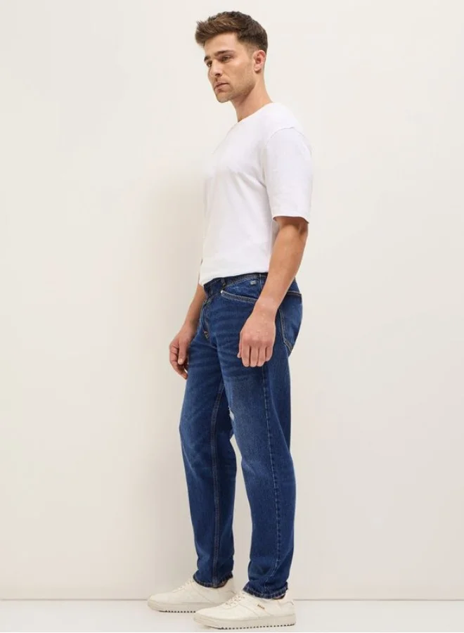 The Bear House  Men's Blue with Light Fade Distressed Patch Mid-Rise Relaxed Fit Jeans Classic Comfort With Modern Style, Perfect For Everyday Casual Looks And Effortless Streetwear Vibes for Men | Best Price UAE
