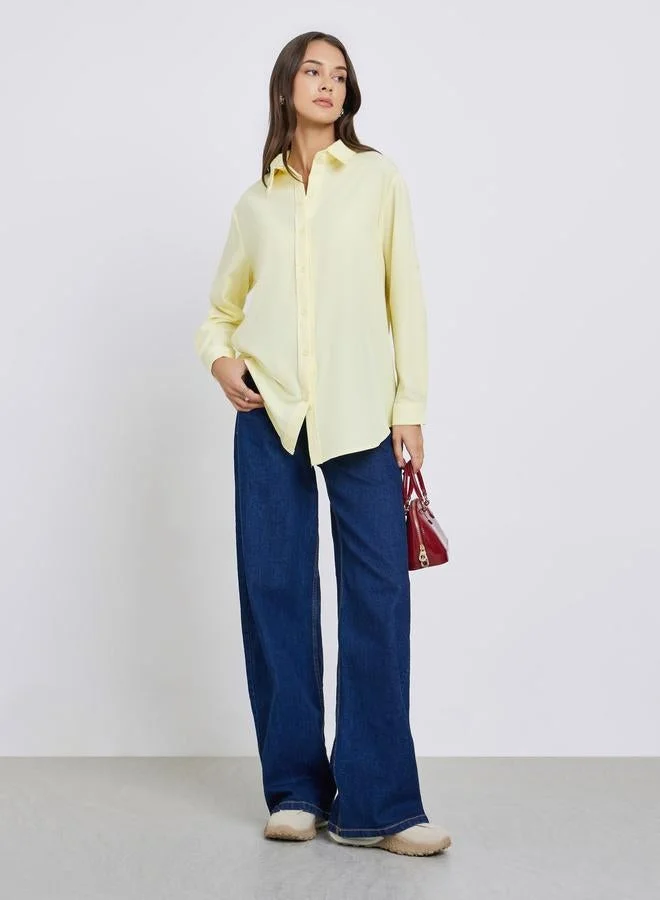ستايلي قميص واسع أصفر بأزرار أمامية