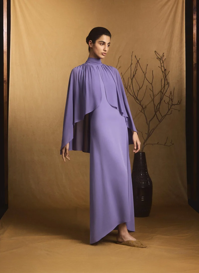 Maxi dress with voluminous sleeves and bow at the neck