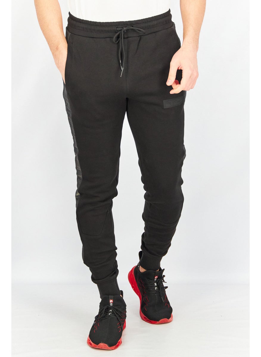 PUMA Puma x Batman Men Sportswear Fit Drawstring Outdoor Track Pants, Black  - Image 1