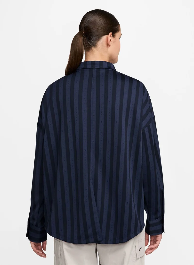 نايكي قميص بأزرار بنقشة الجاكار المخطط