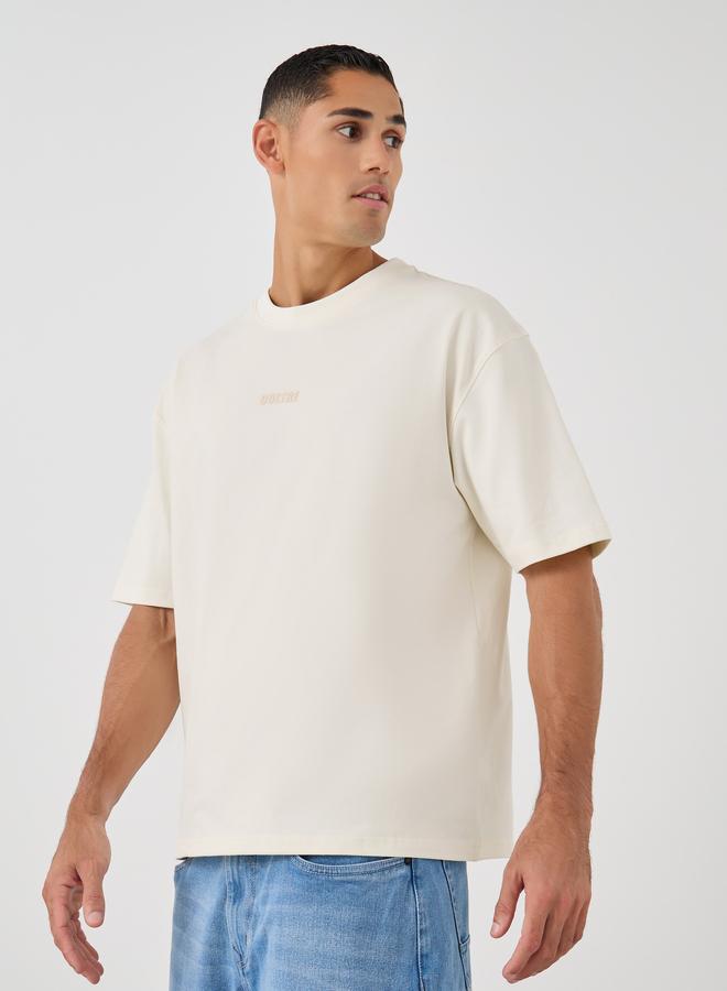 Styli Oversized Stretch Athleisure T-Shirt with Slogan Print - Image 1