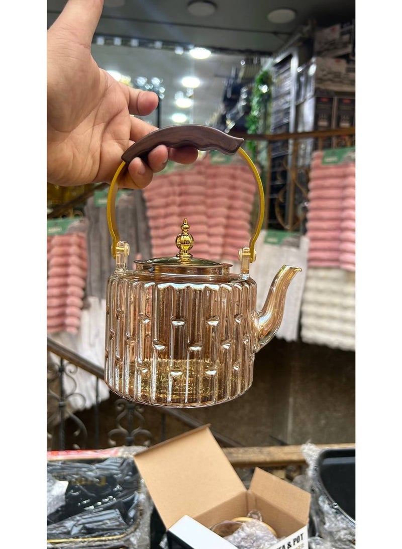 Thermal glass kettle with a thermal wooden handle, a golden lid, thermal glass that can withstand high temperatures, direct fire, and an internal filter so you can make the best herbs  - Image 1