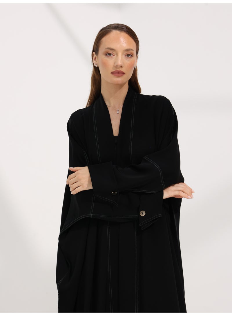 Khan&Co. Seven Seas Black Abaya in black crepe fabric with two silver KHAN&CO logo buttons - Designed by Abdullah Khan - Image 5