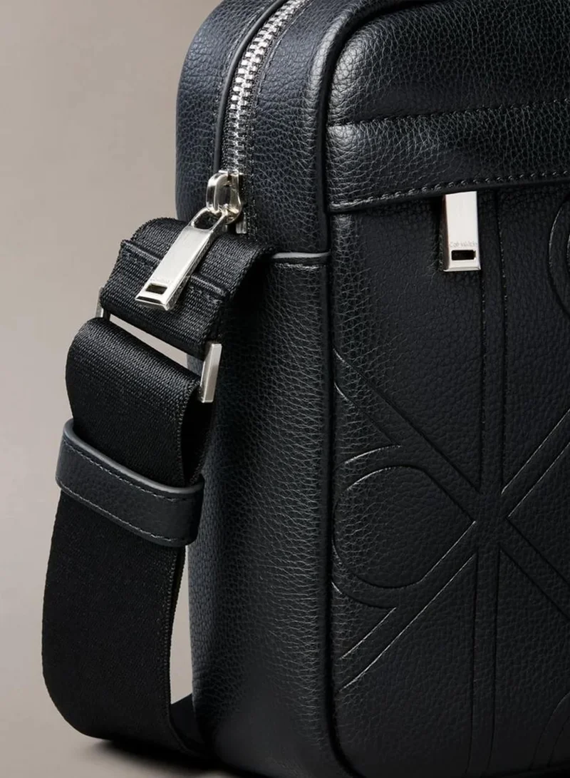 Calvin Klein Black Allover Embossed Emblem Logo Reporter Bag for Men | Best Price UAE