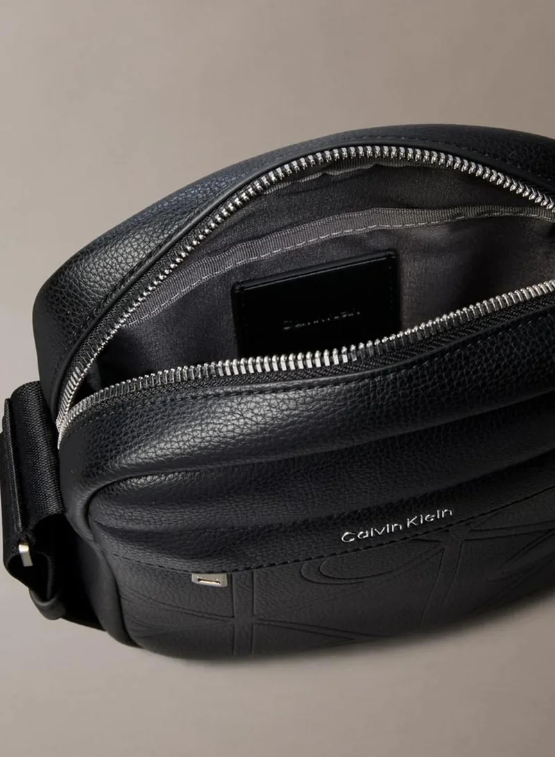 Calvin Klein Black Allover Embossed Emblem Logo Reporter Bag for Men | Best Price UAE