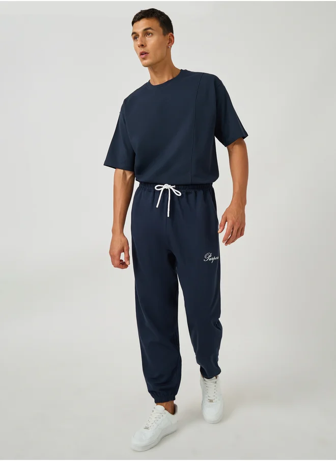 ستايلي Styli Minimal Slogan Print Oversized Joggers with Drawstring