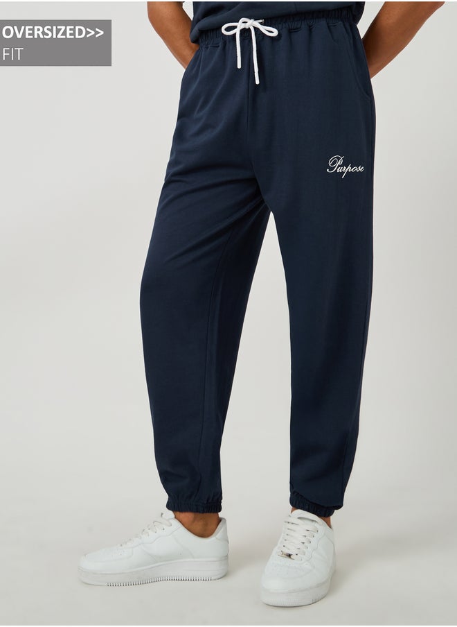 Styli Styli Minimal Slogan Print Oversized Joggers with Drawstring  - Image 1