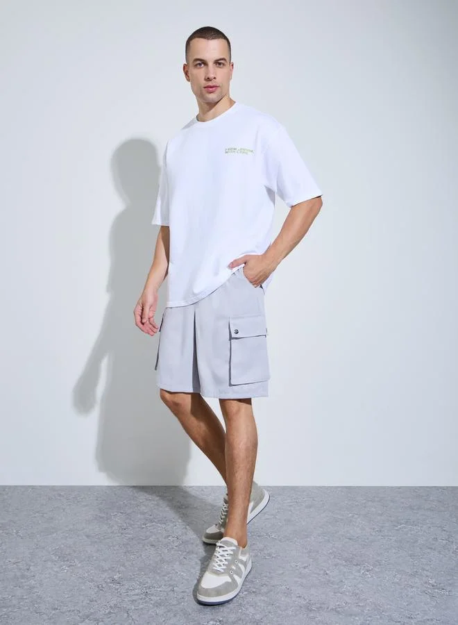 Styli Men White Graphic Print Oversized T-Shirt