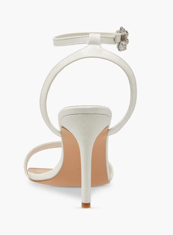 فلورا بيلا من شو إكسبرس Women Embellished Sandals with Stiletto Heels and Buckle Closure