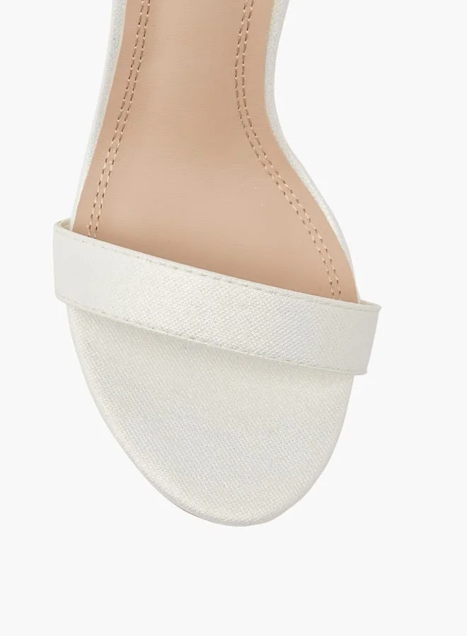 فلورا بيلا من شو إكسبرس Women Embellished Sandals with Stiletto Heels and Buckle Closure