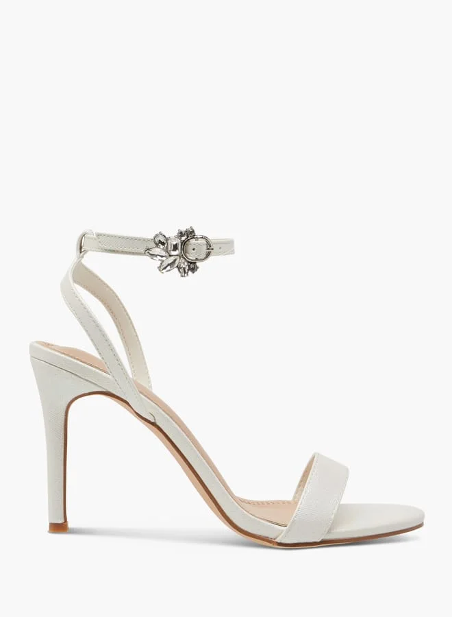 فلورا بيلا من شو إكسبرس Women Embellished Sandals with Stiletto Heels and Buckle Closure