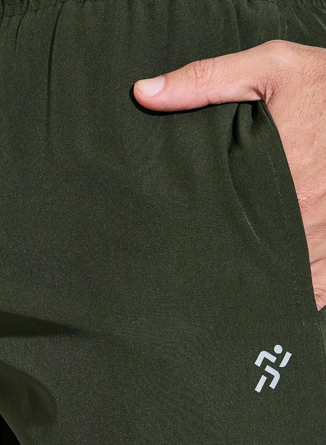 Styli  Olive Solid Drawstring Running Shorts with Side Pockets for Men | Best Price UAE