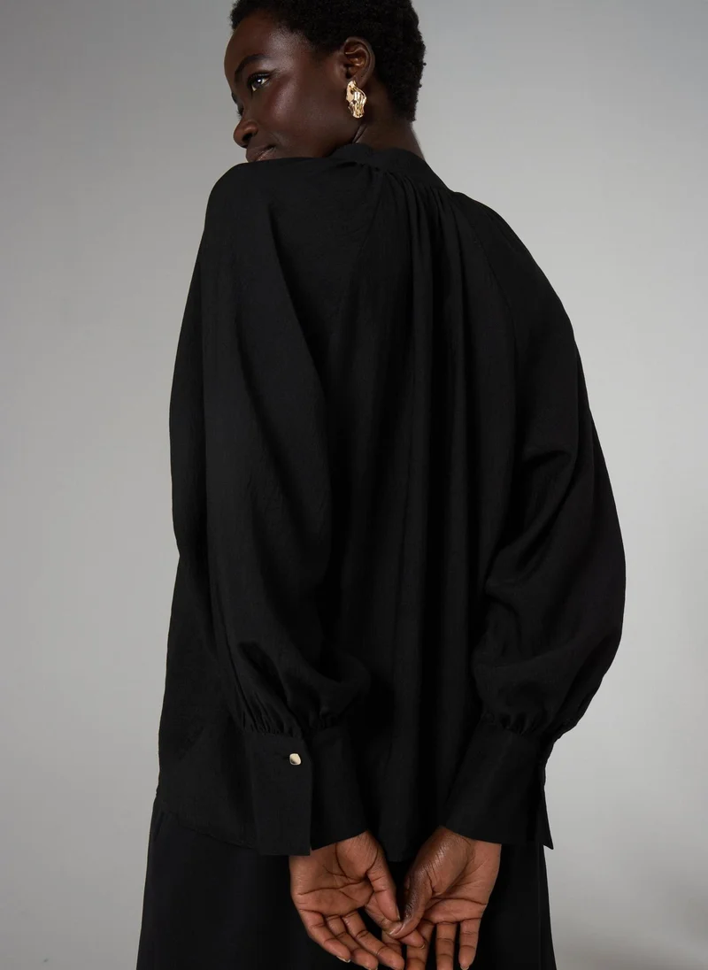 ماتلان بلوزة بوب أوفر بأكمام طويلة سوداء من إت يو