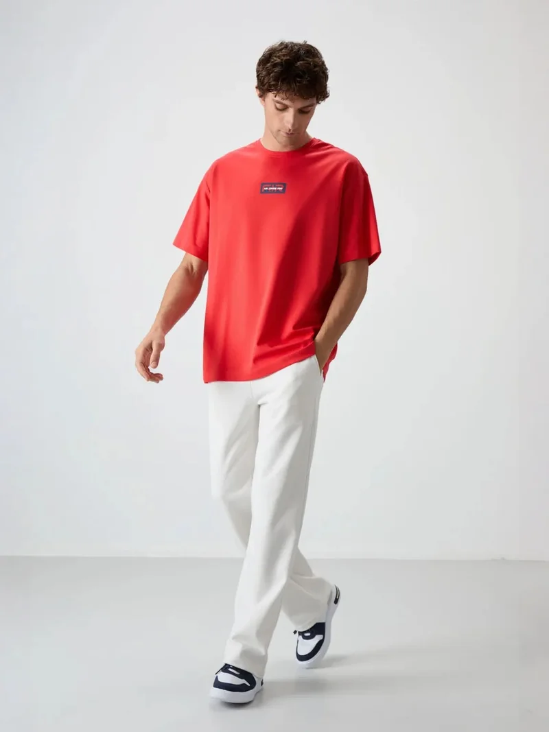 تومي لايف TOMMY Oversized Logo Patch T-Shirt