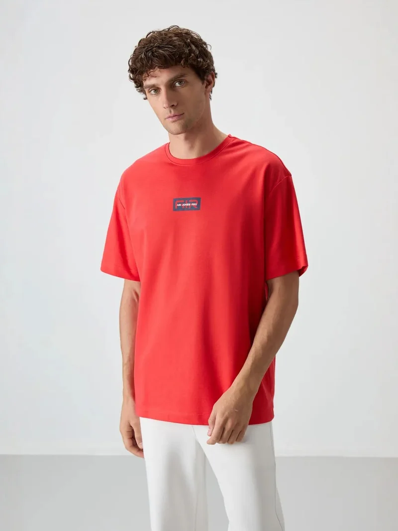 تومي لايف TOMMY Oversized Logo Patch T-Shirt