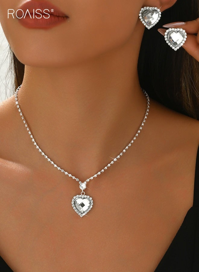 رويس طقم مجوهرات فضي على شكل قلب، طقم أقراط وقلادة مرصعة بأحجار الراين، طقم مجوهرات لحفلات الزفاف الرسمية للنساء والعرائس - Image 1