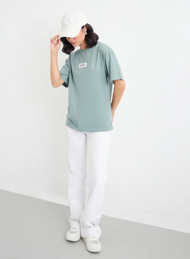 Styli Styli Green Oversized T-Shirt with Patch Detail