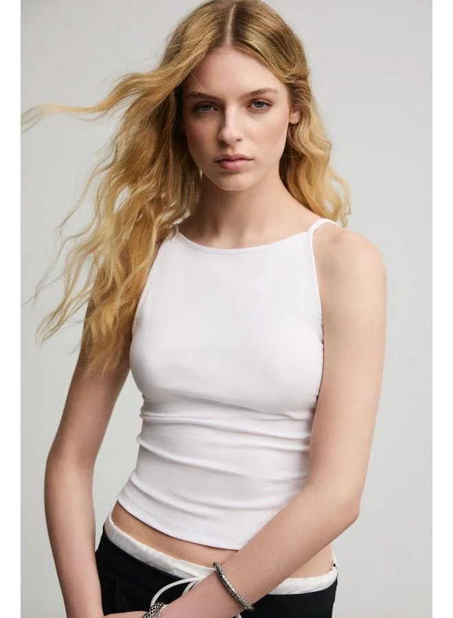 Grimelange CELISSE Women's Soft and Stretchy Fabric Organic Cotton Backless Strappy White Blouse.