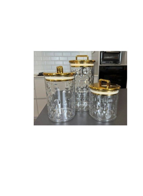 The most beautiful Mother's Day gifts, a very chic 3-in-1 set of acrylic jars with a rectangular gold handle and a gold letter on the base. It will impress your guests and is a masterpiece in the coffee corner. It can be used for storing tea, sugar, and coffee, as well as candy and nuts, and for storing legumes and pasta. It consists of 3 jars of different sizes. With a very tight gold-plated lid, it is a very valuable gift. A high-quality imported product.