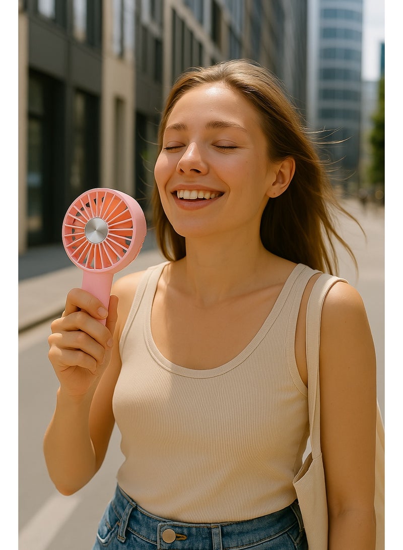 مروحة يد صغيرة YM88206 - قابلة للشحن بقوة تبريد عالية -  تصميم صغير وخفيف مناسب للحمل في أي مكان – بطارية قابلة لاعادة الشحن – بمنفذ شحن USB  - مناسبة للاطفال من 6 سنوات لاكثر -  لون وردي - Image 3