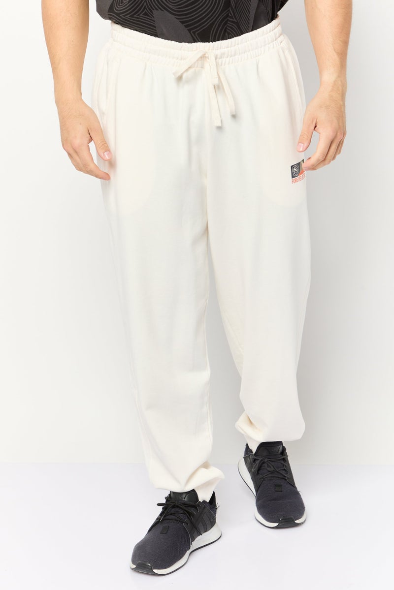 PUMA Men Sportswear Fit Outdoor Sweatpants, Cream  - Image 1