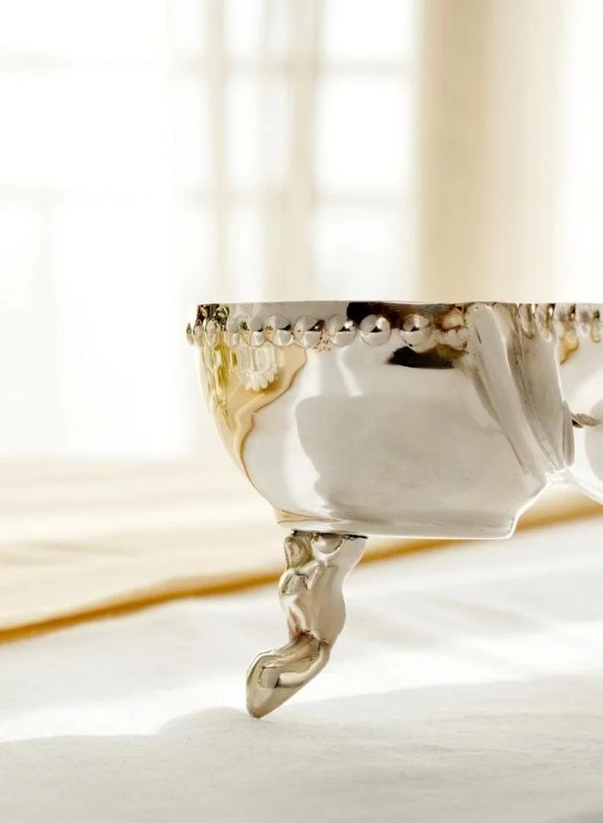 Casa Quesera Celebrate every occasion with this handcrafted 3-bowl silver-plated platter featuring a solid brass base, gracefully perched on a vintage-inspired  stand. Perfect for serving nuts, sweets, dips, or snacks, it combines timeless design with everyday functionality. A stunning centerpiece and a perfect gift for weddings, festivals, or housewarmings.
