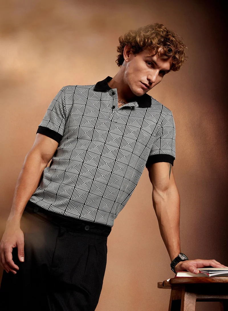 Campus Sutra Campus Sutra Men's Black & White Optical-Illusion Polo T-Shirt For Casual Wear | Polo Neck | Short Cuffed Sleeves | Half-Button Closure | T-Shirt Crafted With Comfort Fit For Everyday Wear