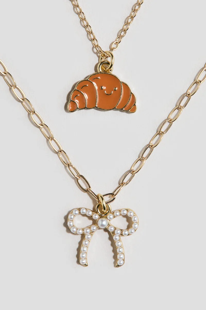 اتش اند ام قلادة ثنائية الخيوط مزيّنة بحلية