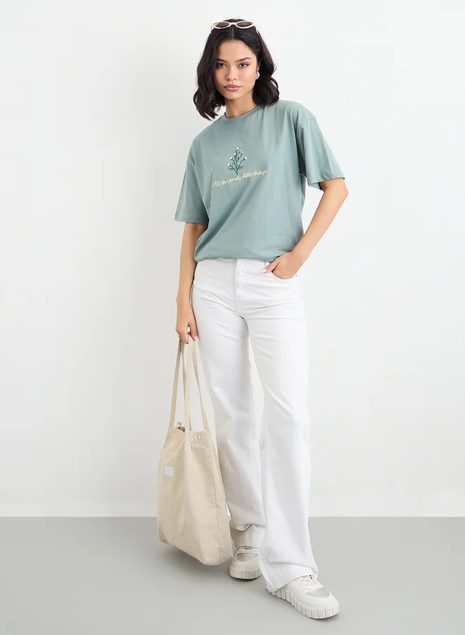 ستايلي Styli Embroidered Slogan Short Sleeves Oversized T-Shirt