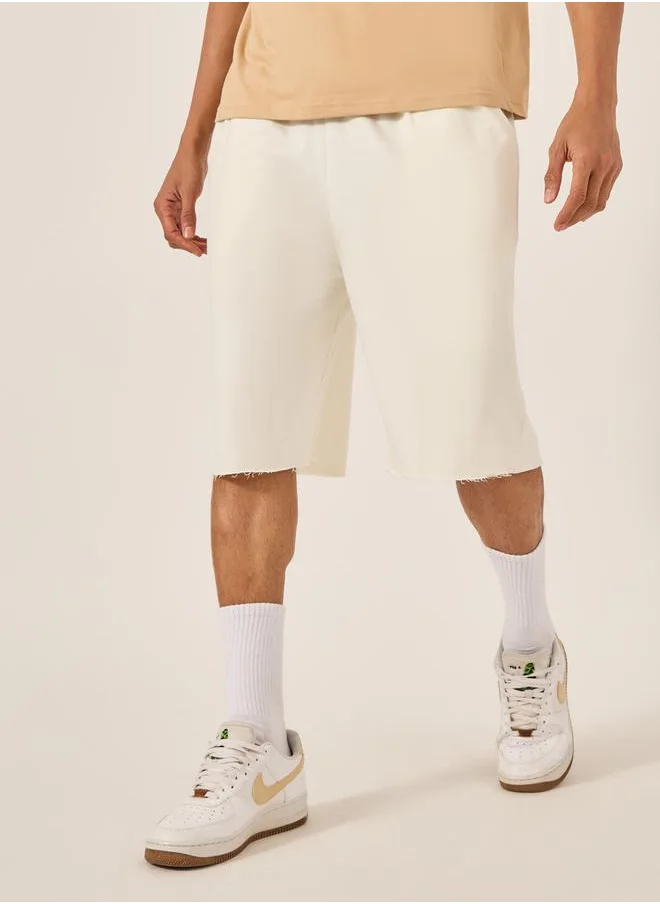 Styli Solid Raw Edge Hem Terry Oversized Shorts