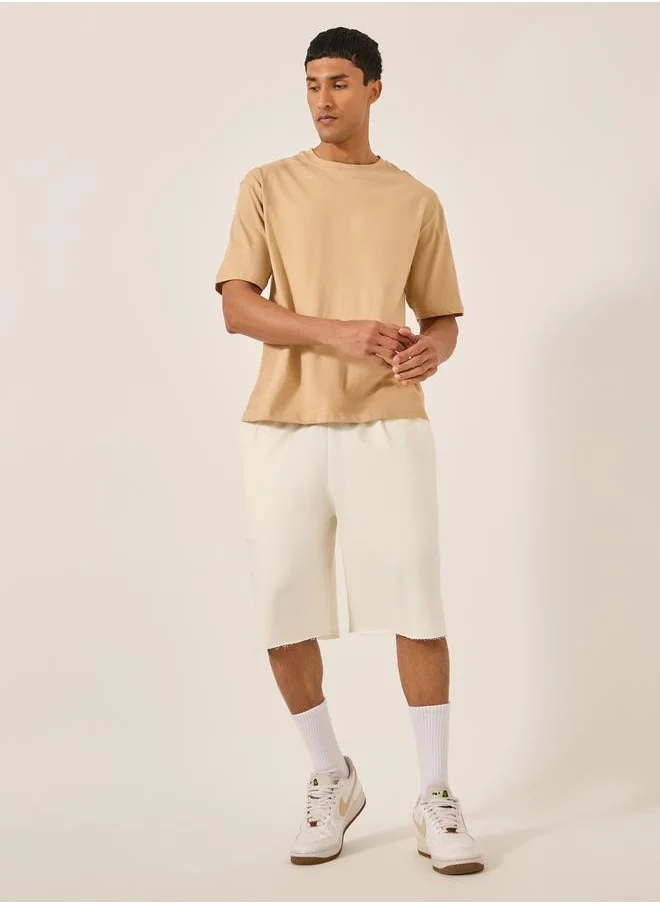 Styli Solid Raw Edge Hem Terry Oversized Shorts
