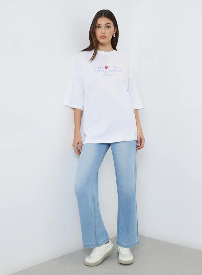 ستايلي تيشيرت واسع بطبعة كتابة